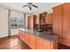 Home office with wood cabinets, granite counter, hardwood floors at 973 Bearded Oaks Ter, Longwood, FL 32779