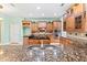 Large kitchen with granite countertops and wood cabinets at 973 Bearded Oaks Ter, Longwood, FL 32779