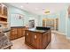 Island kitchen with granite countertops and wood cabinets at 973 Bearded Oaks Ter, Longwood, FL 32779
