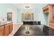 Kitchen with granite counters, wood cabinets, and a breakfast nook at 973 Bearded Oaks Ter, Longwood, FL 32779