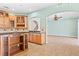 Eat-in kitchen with island, granite counters, and wood cabinets at 973 Bearded Oaks Ter, Longwood, FL 32779