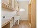 Bright laundry room with cabinets, sink, and built-in shelving at 973 Bearded Oaks Ter, Longwood, FL 32779