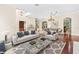 Spacious living room with hardwood floors and staged furniture at 973 Bearded Oaks Ter, Longwood, FL 32779