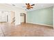 Spacious living room with tile floors and access to kitchen and backyard at 973 Bearded Oaks Ter, Longwood, FL 32779