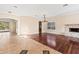 Open living area with hardwood floors, tile floors, and a fireplace at 973 Bearded Oaks Ter, Longwood, FL 32779