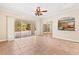 Living area with sliding doors leading to the pool and patio at 973 Bearded Oaks Ter, Longwood, FL 32779