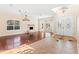 Open living area with hardwood floors, tile entryway, and a fireplace at 973 Bearded Oaks Ter, Longwood, FL 32779
