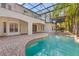 Freeform pool with brick decking and covered patio at 973 Bearded Oaks Ter, Longwood, FL 32779