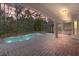 Inviting pool area with brick patio and outdoor kitchen at 973 Bearded Oaks Ter, Longwood, FL 32779