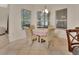 Cozy breakfast nook with a round table and three chairs near a window at 151 Saddlebrook Way, Deland, FL 32724