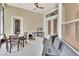 Relaxing screened lanai with seating, table, and ping pong at 151 Saddlebrook Way, Deland, FL 32724