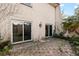 Stone patio with sliding glass doors to interior at 206 Krider Rd # 206, Sanford, FL 32773