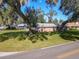 Ranch home with large tree and spacious yard at 2129 Lime Tree Dr, Edgewater, FL 32141
