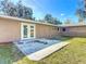 Private backyard with a patio and mature trees at 2129 Lime Tree Dr, Edgewater, FL 32141