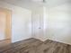 Bright bedroom with wood-look floors and access to a bathroom at 2129 Lime Tree Dr, Edgewater, FL 32141