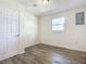 Simple bedroom with wood-look floors and a closet at 2129 Lime Tree Dr, Edgewater, FL 32141