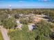 Aerial view of neighborhood with mature trees and homes at 2129 Lime Tree Dr, Edgewater, FL 32141