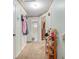 Clean hallway with carpet, doors to bedrooms and bath at 230 Elmwood Ave # 460, Deland, FL 32724