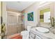 Bathroom with a walk-in shower and modern vanity at 2300 N Atlantic Ave # 1701, Daytona Beach, FL 32118