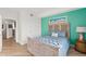 Guest bedroom with light wood bed frame at 2300 N Atlantic Ave # 1701, Daytona Beach, FL 32118