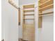 Well-organized closet with shelves and hanging rods at 2300 N Atlantic Ave # 1701, Daytona Beach, FL 32118