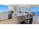 White kitchen with marble counters and ocean view at 2300 N Atlantic Ave # 1701, Daytona Beach, FL 32118