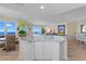 White kitchen with marble island and ocean view at 2300 N Atlantic Ave # 1701, Daytona Beach, FL 32118