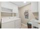 Convenient laundry room with washer, dryer, and storage at 2300 N Atlantic Ave # 1701, Daytona Beach, FL 32118