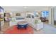 Bright living room features a white sectional sofa and coastal decor at 2300 N Atlantic Ave # 1701, Daytona Beach, FL 32118
