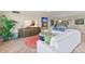 Open living area with white sectional, coastal decor, and ocean view at 2300 N Atlantic Ave # 1701, Daytona Beach, FL 32118