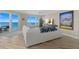 Relaxing living room with white sectional sofa and stunning ocean views at 2300 N Atlantic Ave # 1701, Daytona Beach, FL 32118