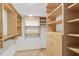 Spacious walk-in closet with ample shelving and hanging space at 2300 N Atlantic Ave # 1701, Daytona Beach, FL 32118