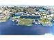 Aerial view showing waterfront property with boat slips and a pool at 2329 River Ridge Rd # 13, Deland, FL 32720