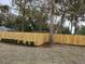 Private backyard with wooden fence and lush landscaping at 2329 River Ridge Rd # 13, Deland, FL 32720