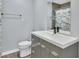 Updated bathroom with gray vanity and a fun shower curtain at 2329 River Ridge Rd # 13, Deland, FL 32720