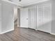 Bright bedroom with double door closet and hardwood floors at 2329 River Ridge Rd # 13, Deland, FL 32720