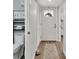 Bright hallway with wood floors and half bath at 2329 River Ridge Rd # 13, Deland, FL 32720