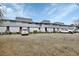 Gray building with parking lot and cars at 2329 River Ridge Rd # 13, Deland, FL 32720