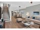 Open living room and kitchen with modern and stylish decor at 2329 River Ridge Rd # 13, Deland, FL 32720