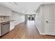 Open living area with wood-look floors and access to a balcony at 2329 River Ridge Rd # 13, Deland, FL 32720