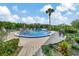 Kidney shaped pool with surrounding patio furniture at 2329 River Ridge Rd # 13, Deland, FL 32720