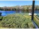 Stunning river view from window, featuring lush vegetation and boats at 2329 River Ridge Rd # 13, Deland, FL 32720