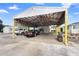 Carport with a lift and storage space at 2480 N Woodland Blvd, Deland, FL 32720