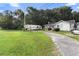A roadside view of a home with ample parking at 2480 N Woodland Blvd, Deland, FL 32720
