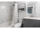 Gray vanity and marble shower/tub combo at 2700 Ocean Shore Blvd # 317, Ormond Beach, FL 32176