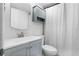 Clean bathroom with gray vanity, white toilet, and shower/tub at 2700 Ocean Shore Blvd # 317, Ormond Beach, FL 32176