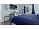 Bedroom with a large TV and a workspace at 2700 Ocean Shore Blvd # 317, Ormond Beach, FL 32176