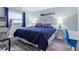 Blue bedroom with a queen bed and ocean decor at 2700 Ocean Shore Blvd # 317, Ormond Beach, FL 32176