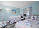 Guest bedroom with two twin beds and ocean-themed bedding at 2700 Ocean Shore Blvd # 317, Ormond Beach, FL 32176