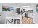 Kitchen and dining area with white table and chairs at 2700 Ocean Shore Blvd # 317, Ormond Beach, FL 32176